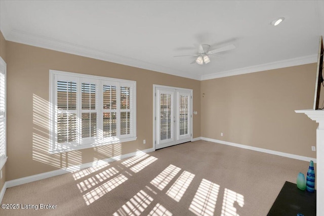 interior space featuring baseboards, ceiling fan, french doors, and crown molding