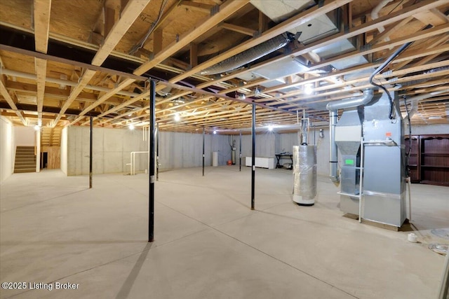 unfinished basement featuring heating unit and gas water heater