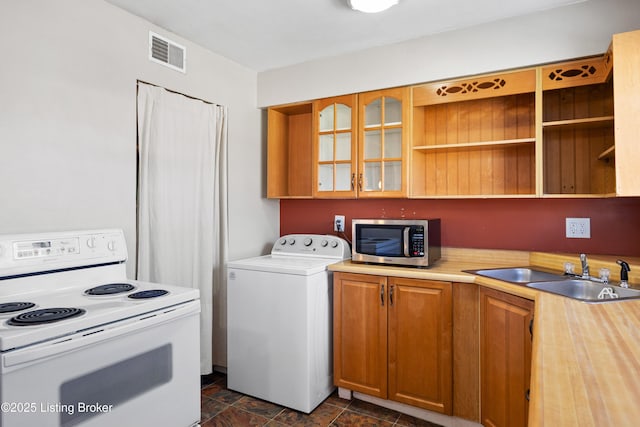 laundry room featuring washer / dryer and sink