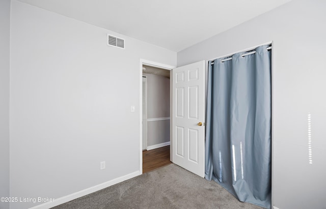 unfurnished bedroom with carpet flooring