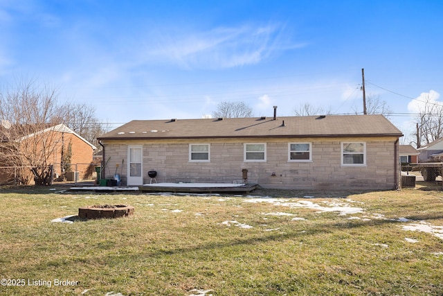 rear view of house with a yard