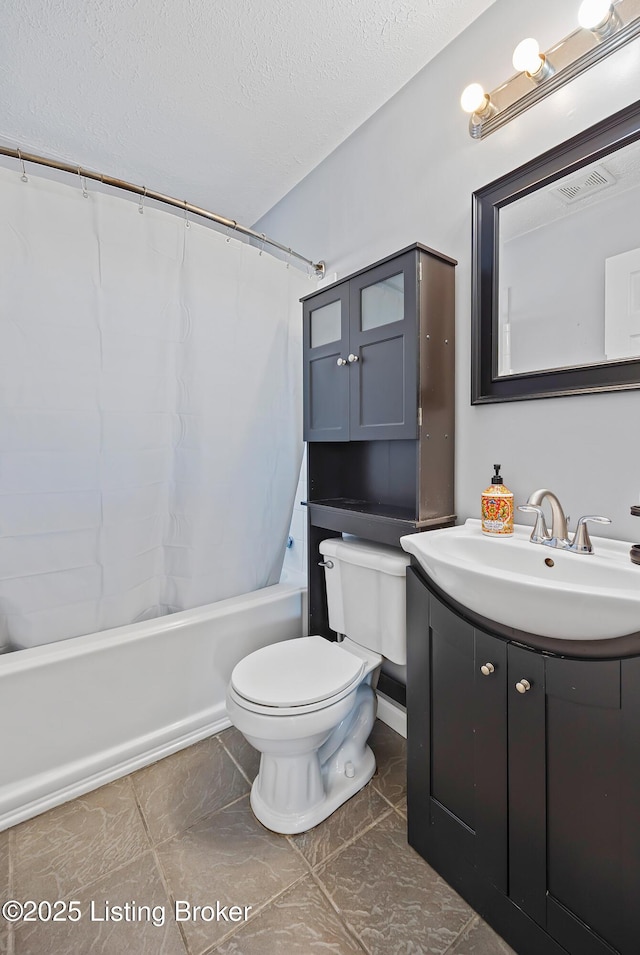 full bathroom with vanity, shower / tub combo with curtain, a textured ceiling, and toilet