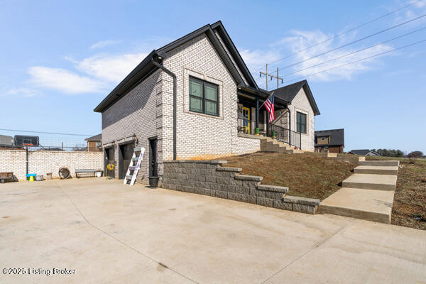 view of side of property with a garage