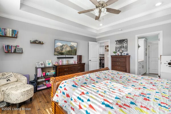 bedroom featuring crown molding, ceiling fan, and a tray ceiling