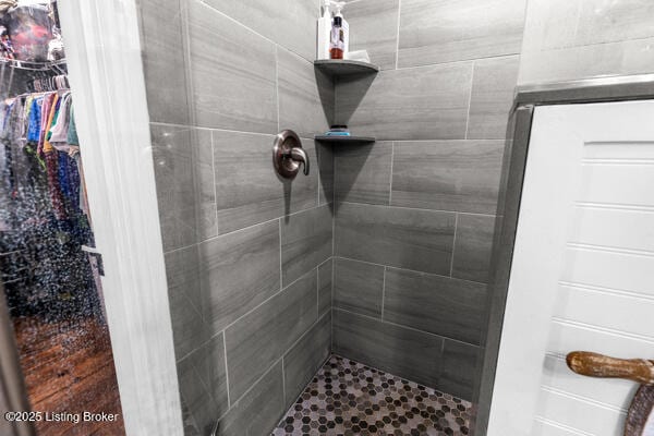 bathroom with tiled shower