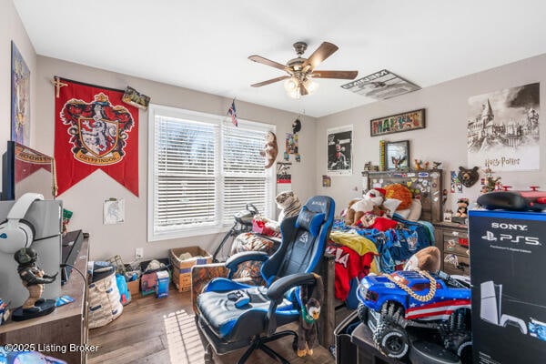 bedroom with ceiling fan and wood-type flooring