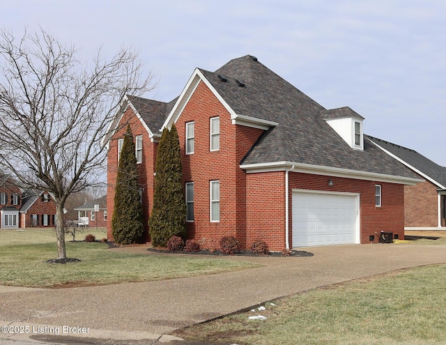 view of side of home with a garage and a yard