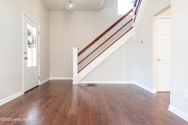 foyer with dark hardwood / wood-style flooring