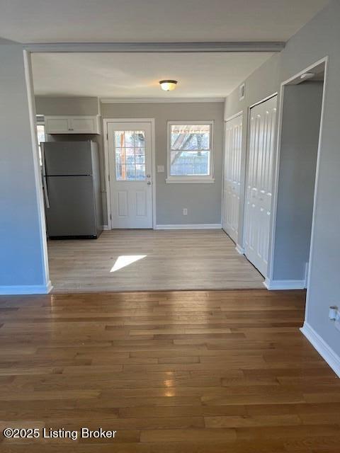 entryway with hardwood / wood-style floors