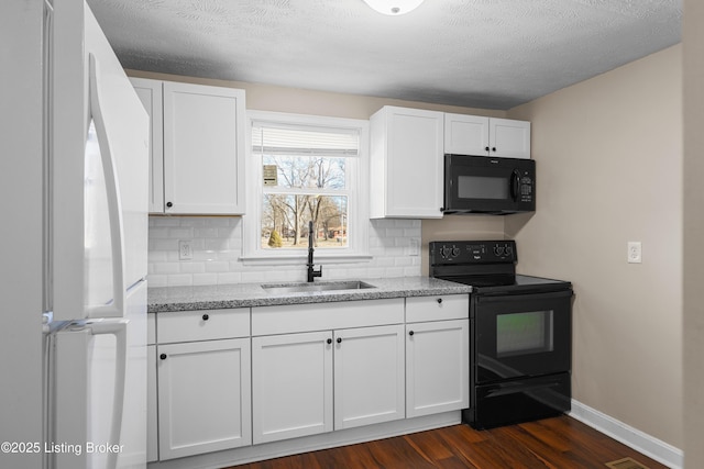 kitchen featuring dark hardwood / wood-style floors, tasteful backsplash, sink, white cabinets, and black appliances