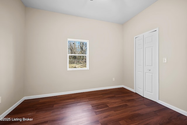 unfurnished bedroom featuring dark hardwood / wood-style flooring