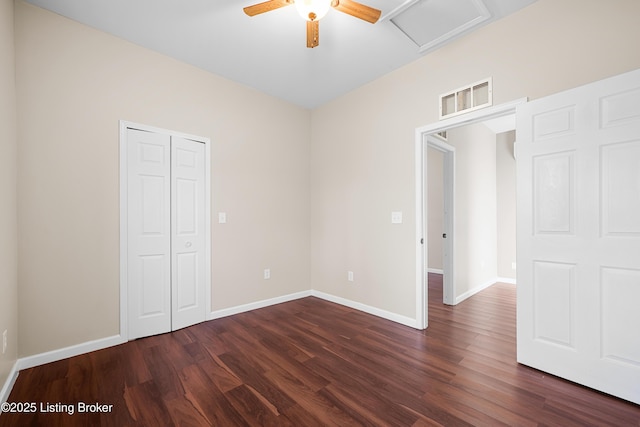 unfurnished bedroom featuring dark hardwood / wood-style floors and ceiling fan