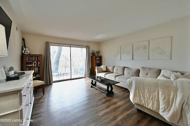 living room with dark hardwood / wood-style flooring