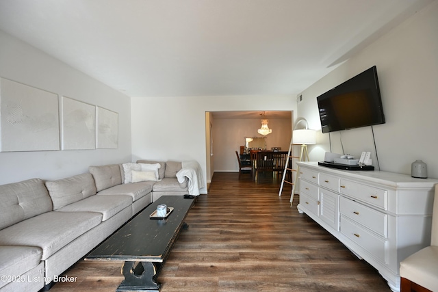 living room with dark hardwood / wood-style floors