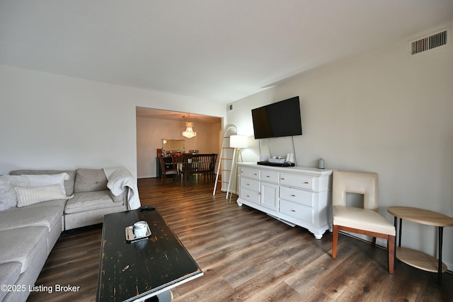 living room with dark hardwood / wood-style floors