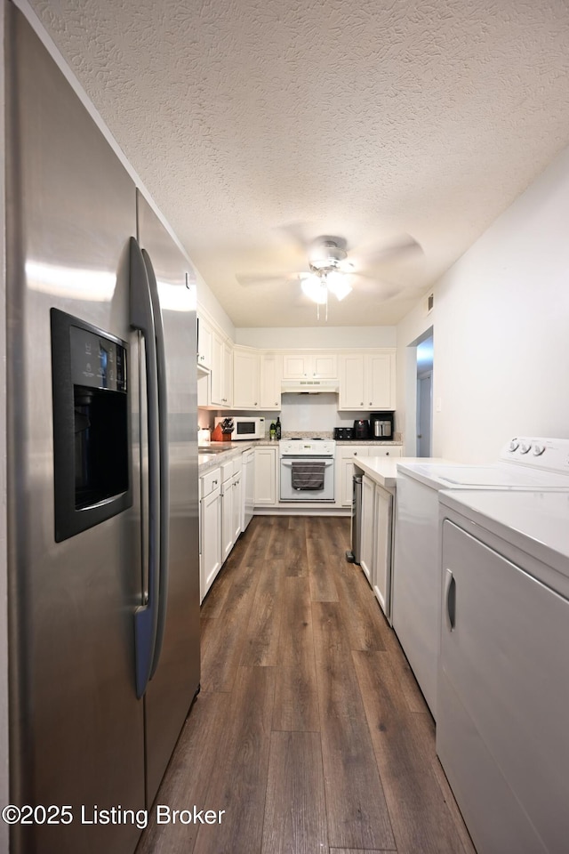 kitchen with dark wood-type flooring, range, white cabinetry, independent washer and dryer, and stainless steel fridge with ice dispenser