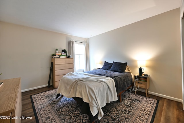 bedroom featuring dark wood-type flooring