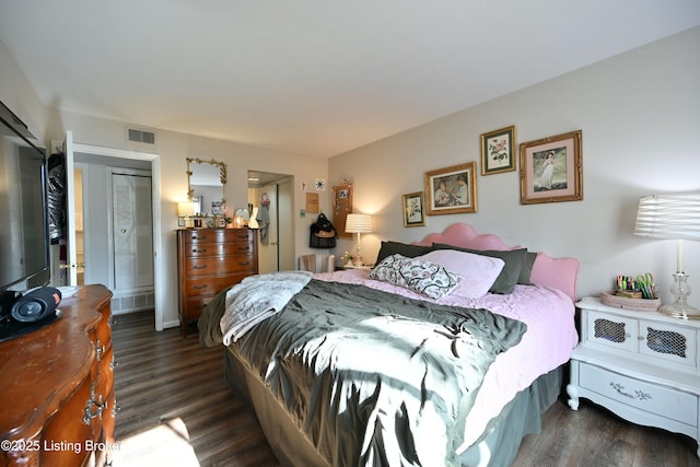 bedroom featuring dark hardwood / wood-style flooring