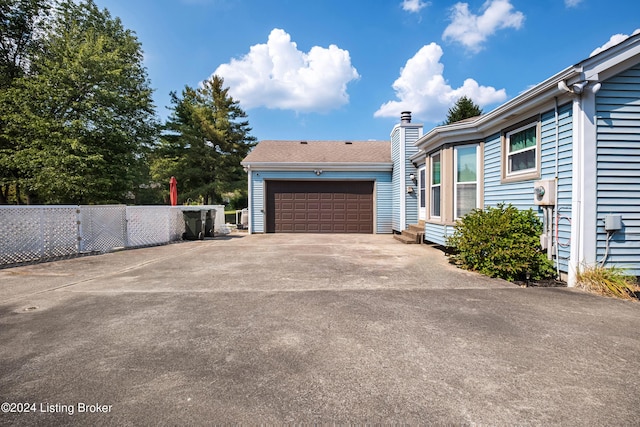 view of property exterior with a garage