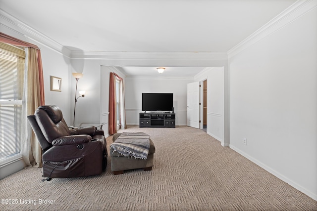 sitting room featuring ornamental molding and carpet