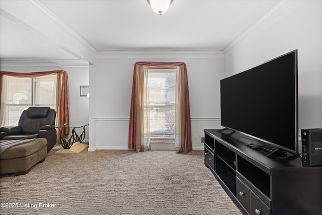 living area with crown molding and carpet flooring