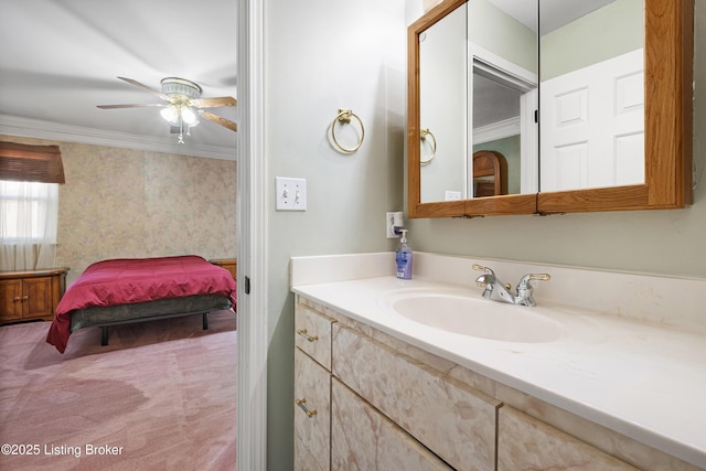 bathroom with vanity, crown molding, and ceiling fan