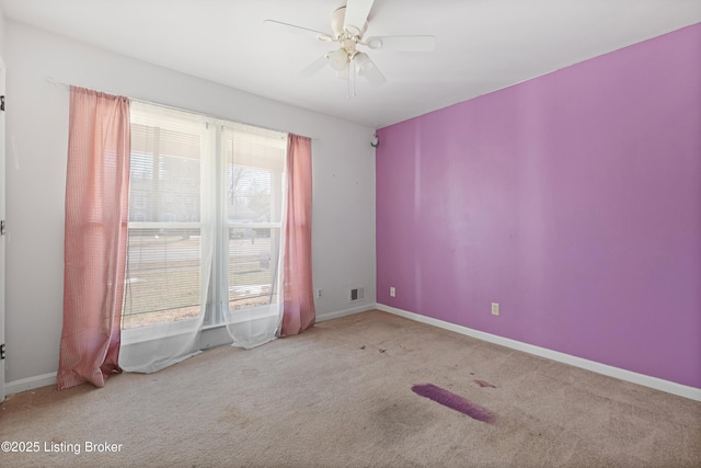 carpeted empty room with ceiling fan