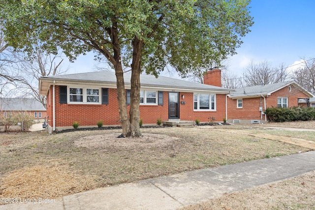 ranch-style home with a front lawn