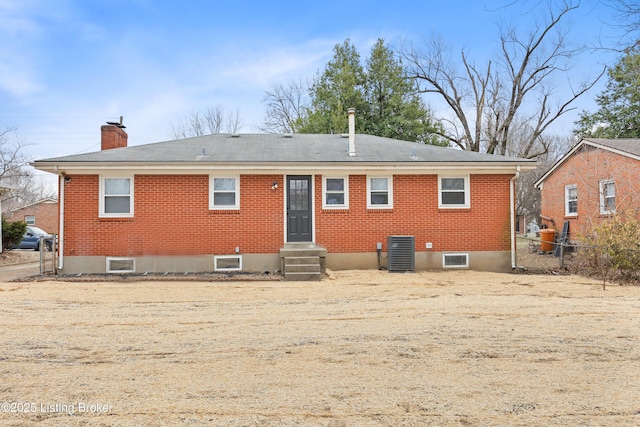 back of house featuring central AC