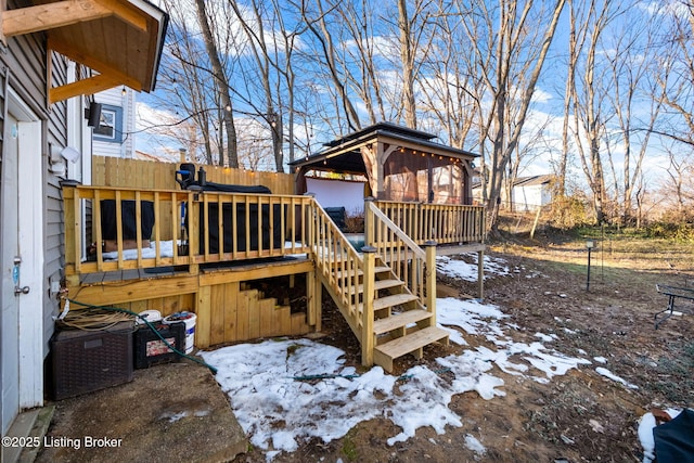 snow covered deck featuring a gazebo