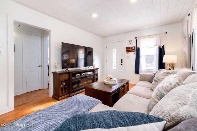 living room featuring light hardwood / wood-style floors and wooden ceiling