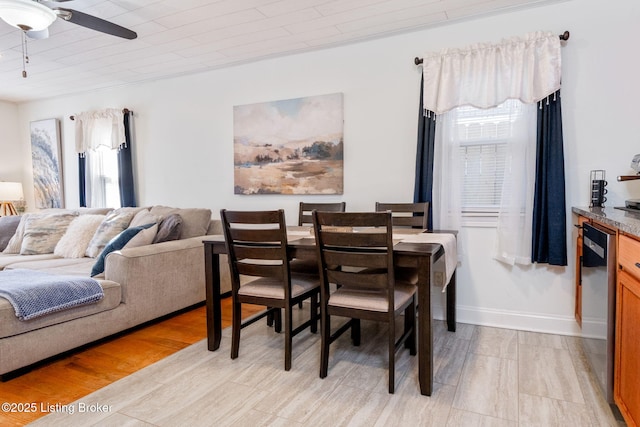 dining room featuring ceiling fan, wooden ceiling, and light hardwood / wood-style floors