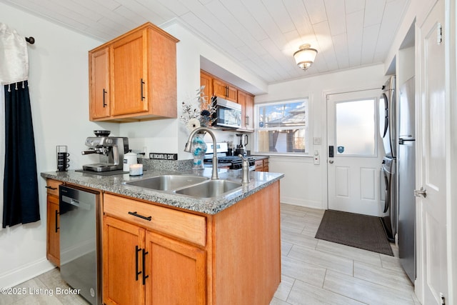 kitchen featuring ornamental molding, appliances with stainless steel finishes, sink, and wood ceiling