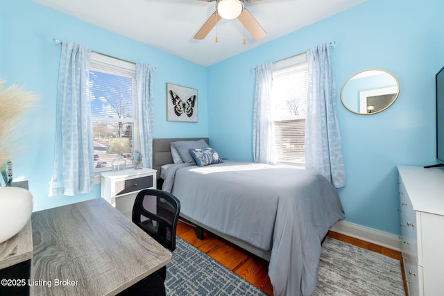 bedroom with hardwood / wood-style floors and ceiling fan