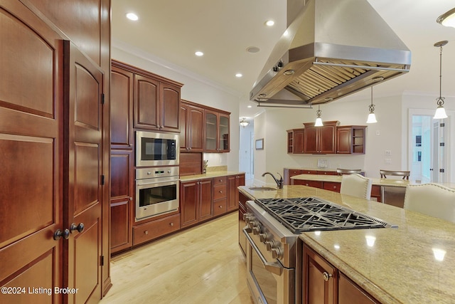 kitchen featuring sink, crown molding, island range hood, hanging light fixtures, and stainless steel appliances