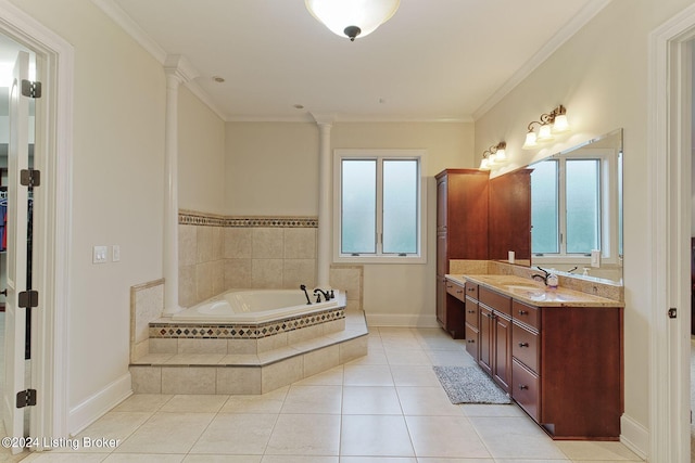 bathroom with crown molding, tile patterned flooring, vanity, a relaxing tiled tub, and ornate columns