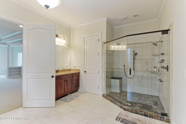 bathroom with crown molding, vanity, a shower with door, and tile patterned flooring