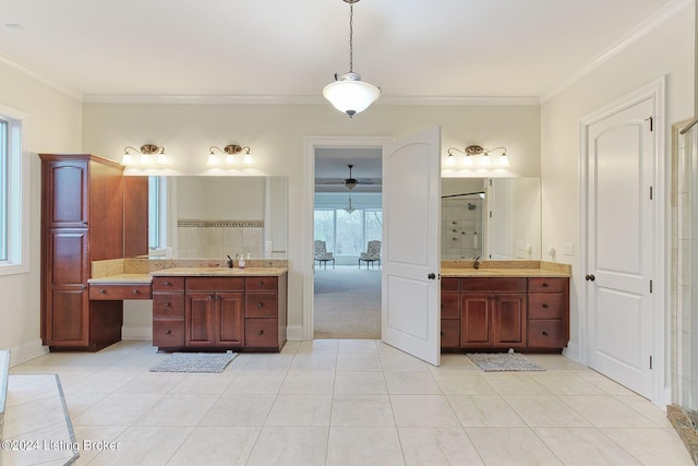 bathroom with tile patterned flooring, crown molding, vanity, and a shower with shower door