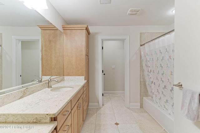 bathroom featuring shower / bath combination with curtain, tile patterned floors, and vanity