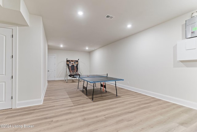 game room with light wood-type flooring