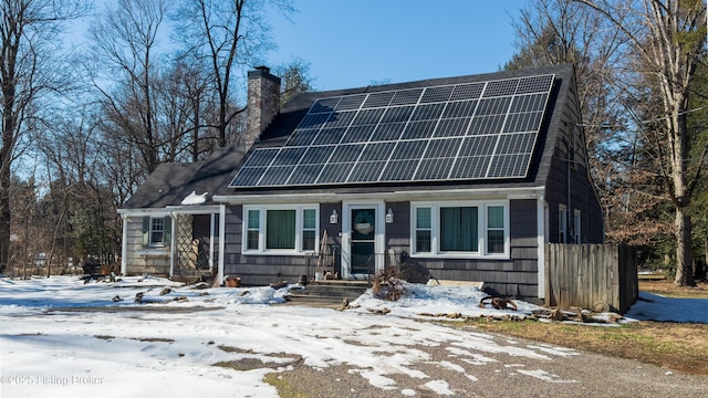 view of front facade with solar panels