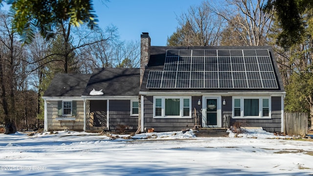 view of front facade with solar panels