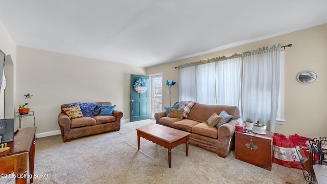 living room featuring light carpet