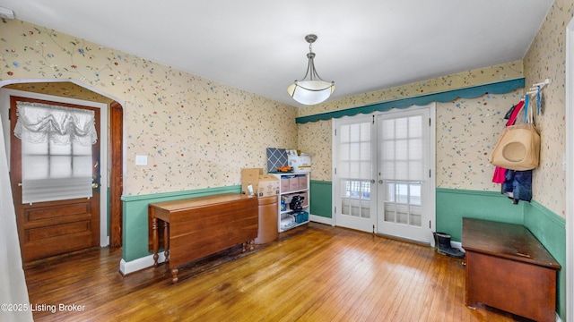 misc room with hardwood / wood-style flooring and french doors