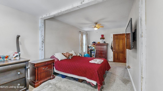 bedroom featuring ceiling fan and light carpet