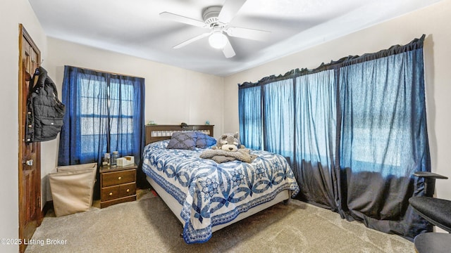 bedroom featuring ceiling fan and carpet flooring