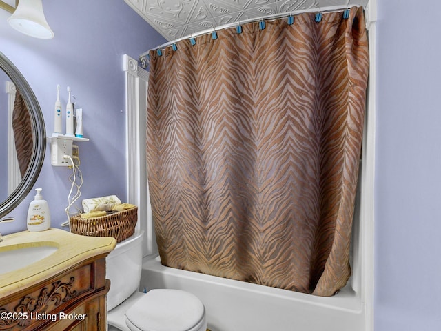 full bathroom featuring vanity, toilet, and shower / bathtub combination with curtain