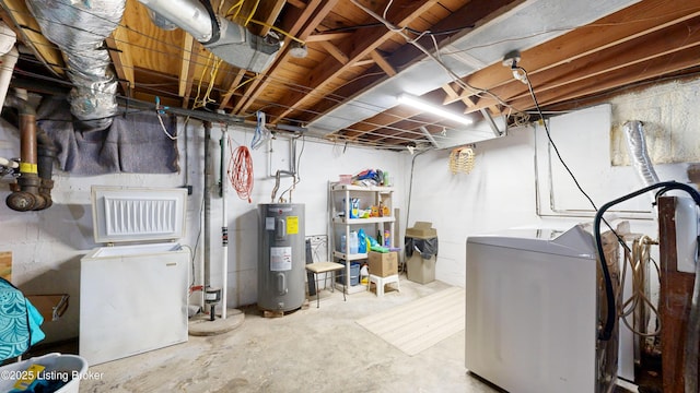 basement featuring separate washer and dryer and electric water heater