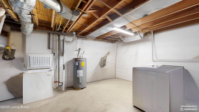 basement with water heater and washer and clothes dryer