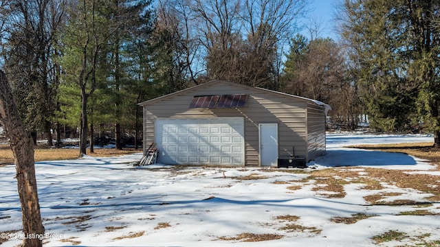 view of snow covered garage